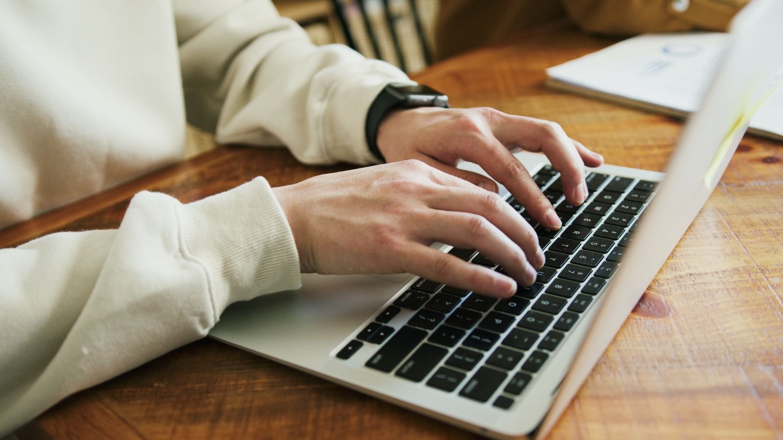 Xero setup mistakes: hands typing on a laptop keyboard while setting up Xero accounting software